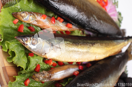Image of fish on plate with red pepper