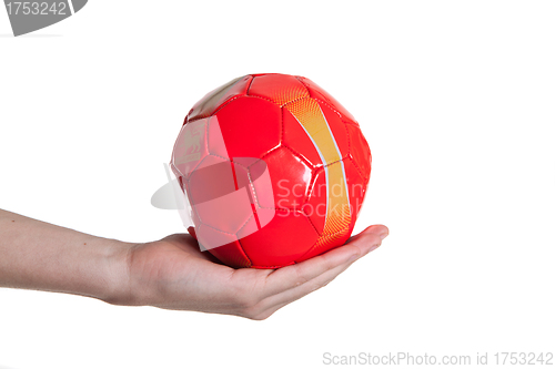 Image of man holding red small football ball