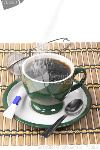 Image of pour sugar into a mug