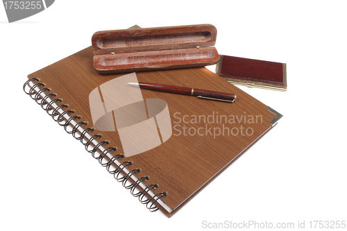 Image of wooden notebook with pen isolated