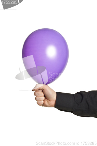 Image of hand holding baloonn