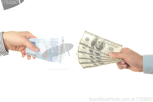 Image of Hands holding euro and dollar bills