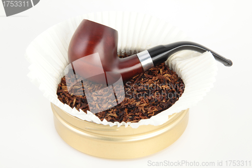 Image of Wooden smoking pipe and tobacco