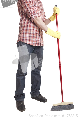 Image of young worker with a broom