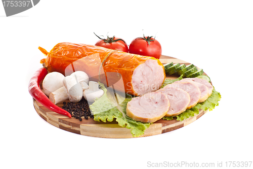 Image of sliced sausage with vegetables