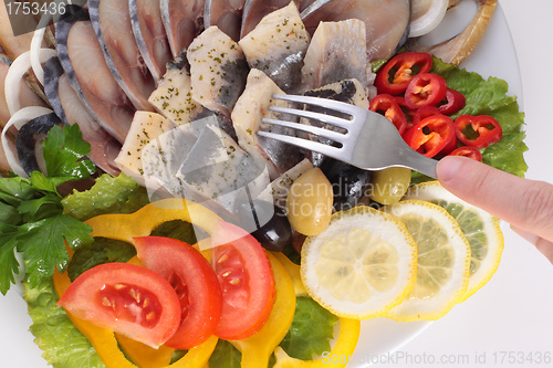 Image of fish with vegetables,anion red pepper