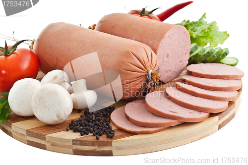 Image of sausage on plate with vegetables