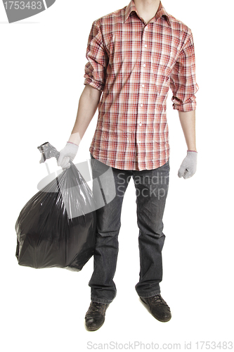 Image of Man holding black plastic trash bag