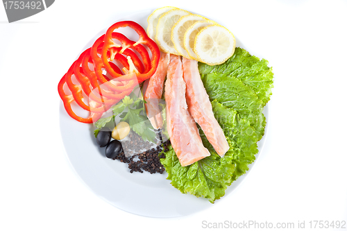 Image of red fish in composition with vegetables