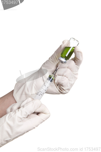 Image of man gaining the liquid in the syringe