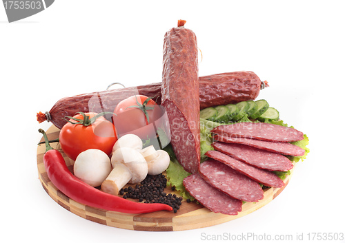 Image of sliced sausage with vegetables and red papper