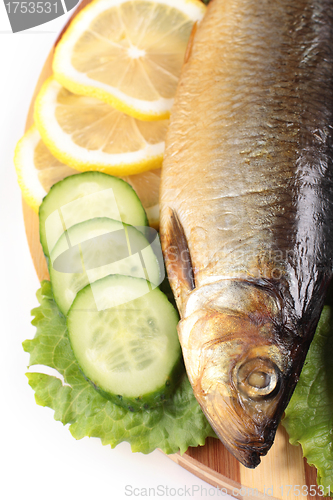 Image of fish with lemon and vegetables