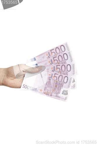 Image of Male hand holding four 500 euro notes isolated