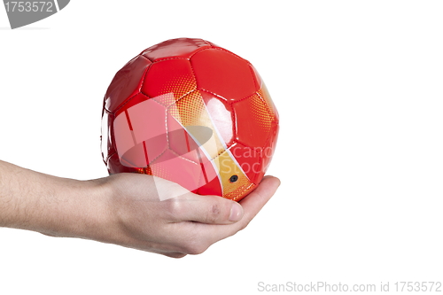 Image of small soccer red ball in hand. Isolated