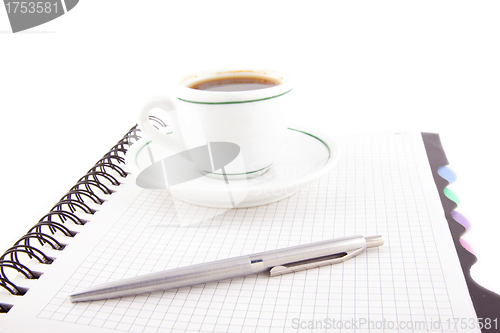 Image of Coffee and pen on notebook