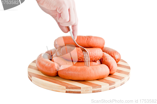 Image of taste delicious sausages on board