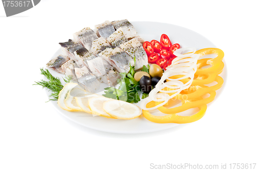 Image of fish on plate with vegetables