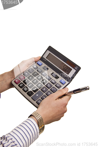 Image of Male businessman using a calculator