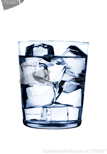 Image of glass with ice cubes on glossy background