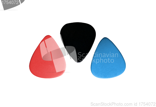 Image of Closeup of 3 colourful plectrums isolated