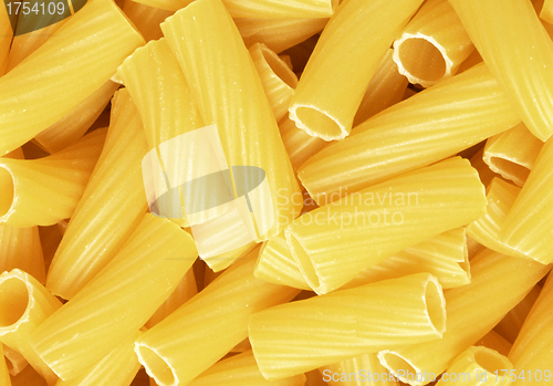 Image of Closeup of uncooked wholewheat italian pasta - penne