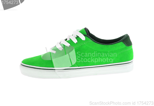 Image of green sneaker with white strips isolated on white background