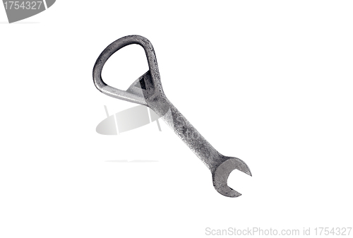 Image of close up of bottle opener and cap on white background