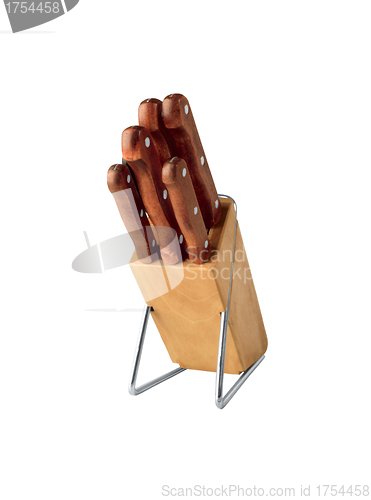 Image of Set of knives in a wooden knife block isolated