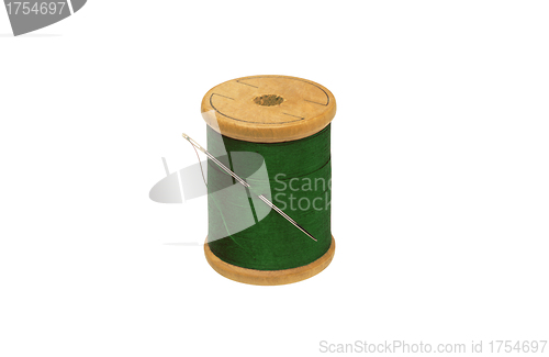 Image of Spool of thread and needle isolated