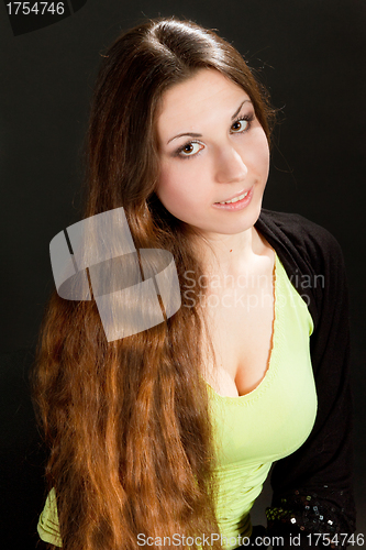 Image of portrait of brown haired girl on black background