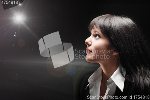 Image of Portrait of brunette girl on dark background