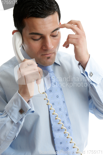 Image of Troubled or depressed businessman making call