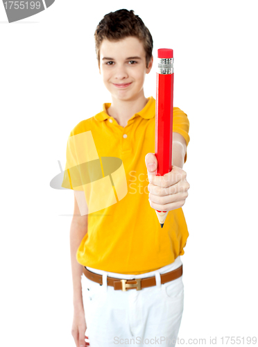 Image of Portrait of a boy offering pencil