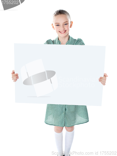 Image of Pretty girl holding blank white poster