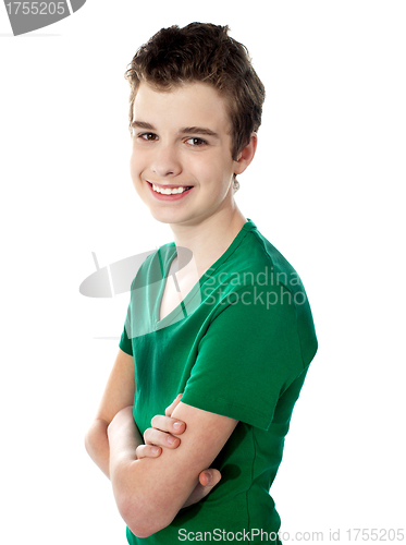 Image of Young boy posing with folded arms