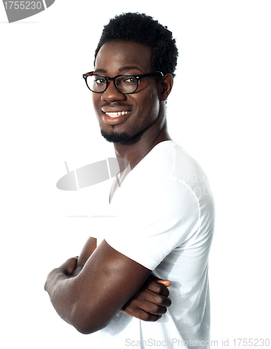 Image of Black man posing with crossed arms