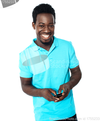 Image of Teenager messaging on phone