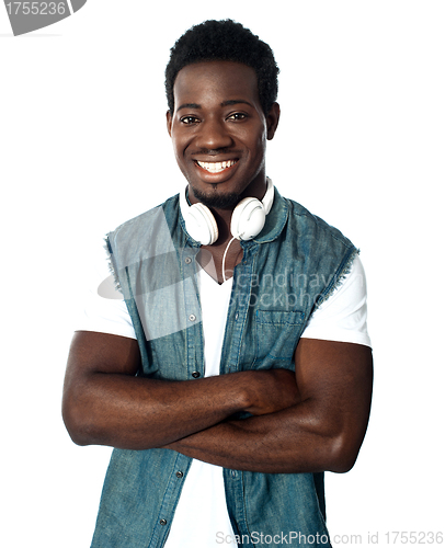 Image of Smiling african boy loves music