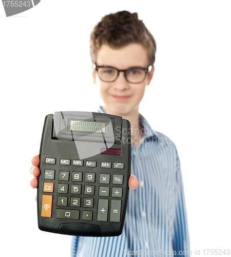 Image of Young boy showing digital calculator