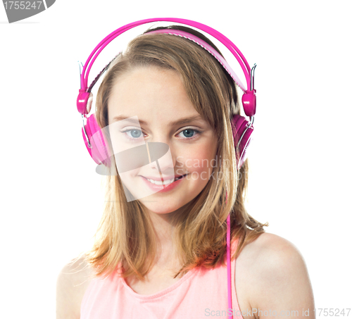 Image of Attractive girl wearing pink headphones