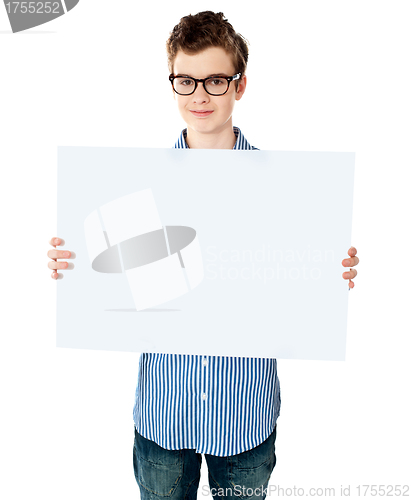 Image of Handsome boy showing an empty billboard