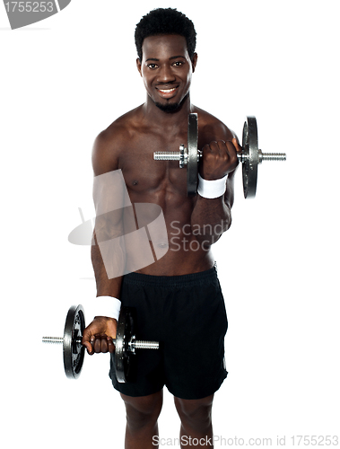 Image of Muscular man doing exercise