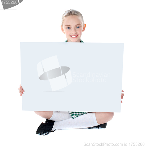 Image of School girl showing blank billboard
