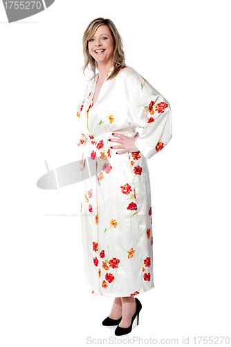 Image of Pretty lady posing with hands on her waist
