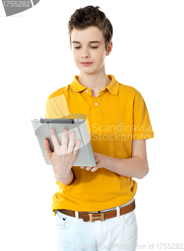 Image of Portrait of a cute boy using a portable device