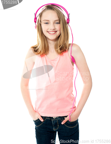 Image of Pretty girl enjoying music through headphones