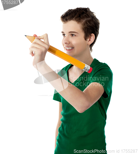 Image of Smiling boy making imaginary drawing