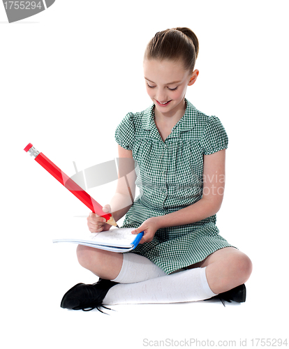 Image of Young girl doing her homework