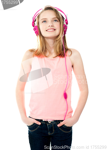 Image of Adorable girl tuned into music