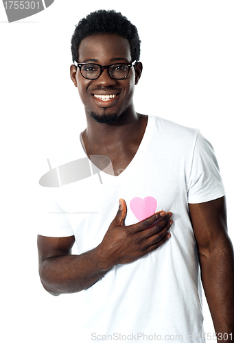 Image of Handsome man holding paper heart